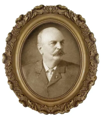 Sepia-toned portrait of a Mr. Goodyear in an ornate oval frame.